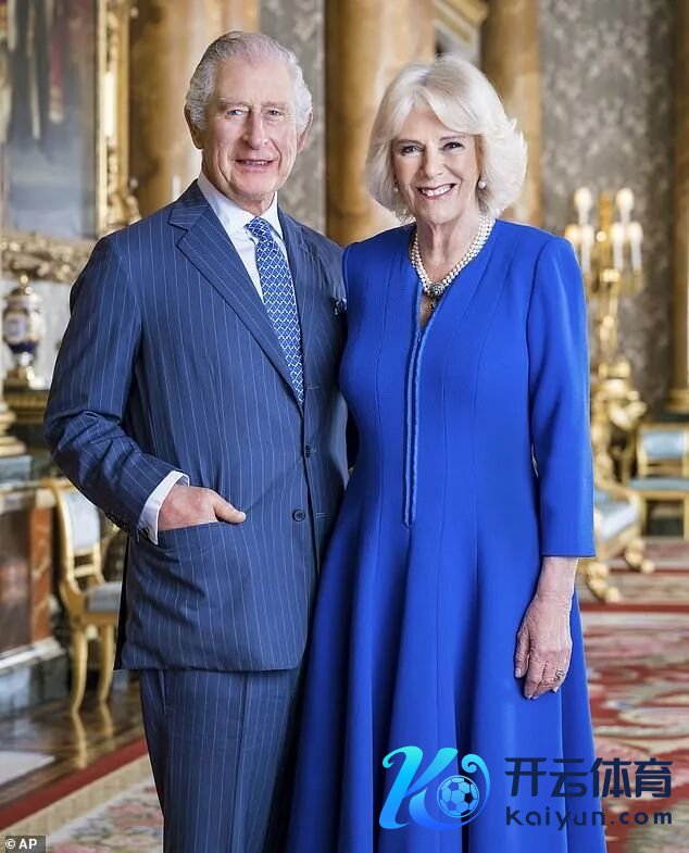 In the newly released Coronation portrait Camilla, in vibrant royal blue with stylised V-neck poses alongside husband, King Charles III